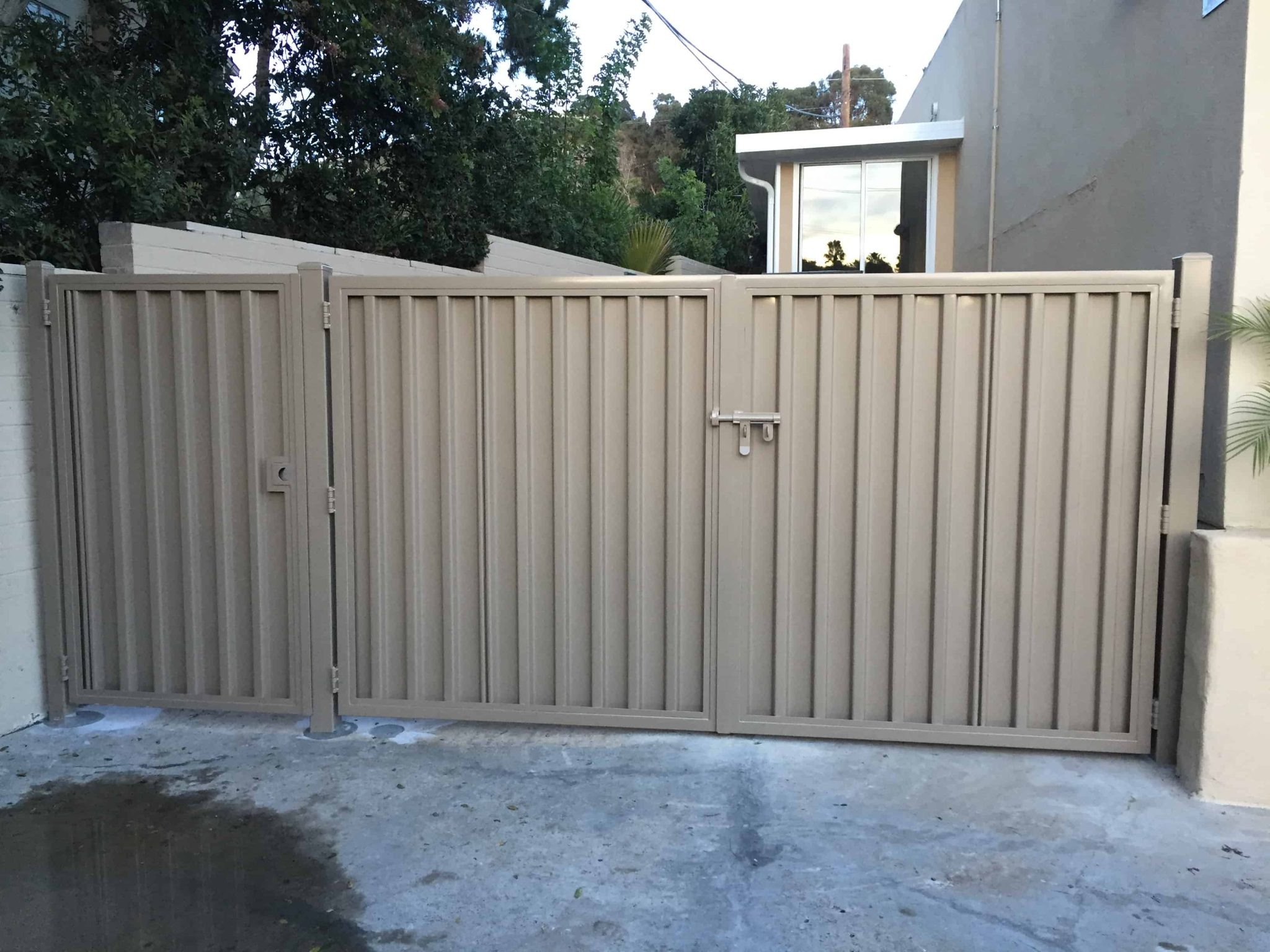 Heavy-duty steel trash enclosure gate fabricated and installed by Fred's Fencing in San Diego
