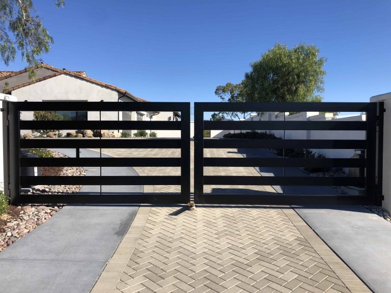 Modern black double swing driveway gate installed at a San Diego home
