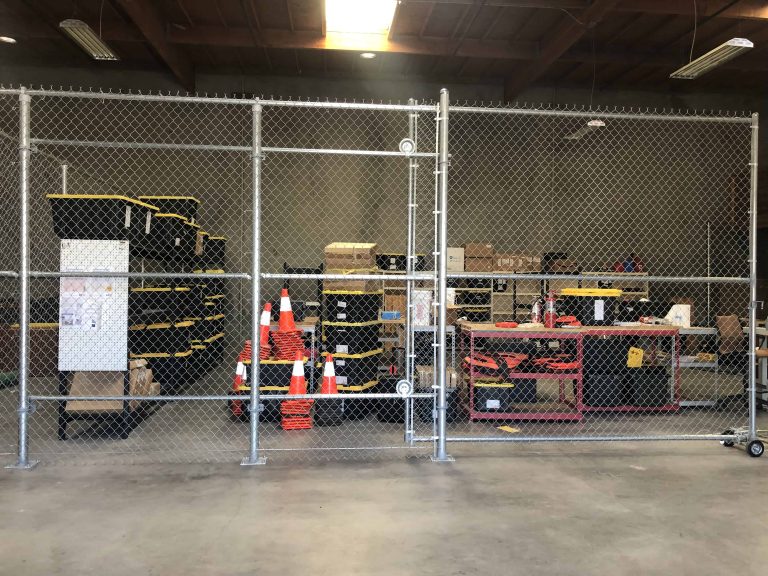 Galvanized chain link fencing and gates securing a commercial interior