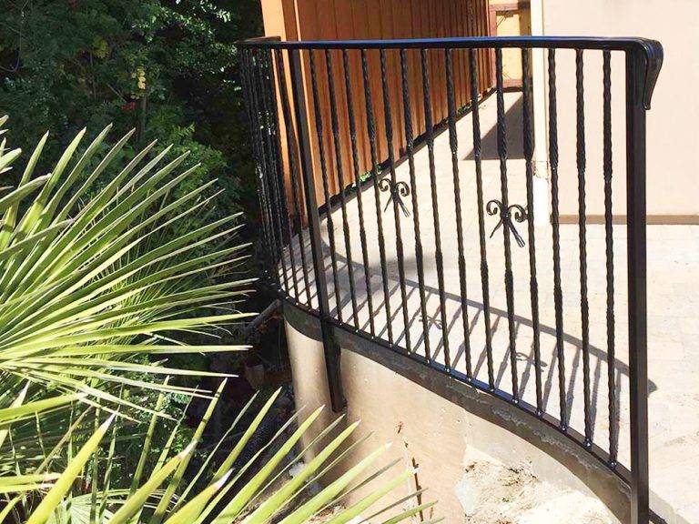Restored and realigned iron railing and gate work in San Diego