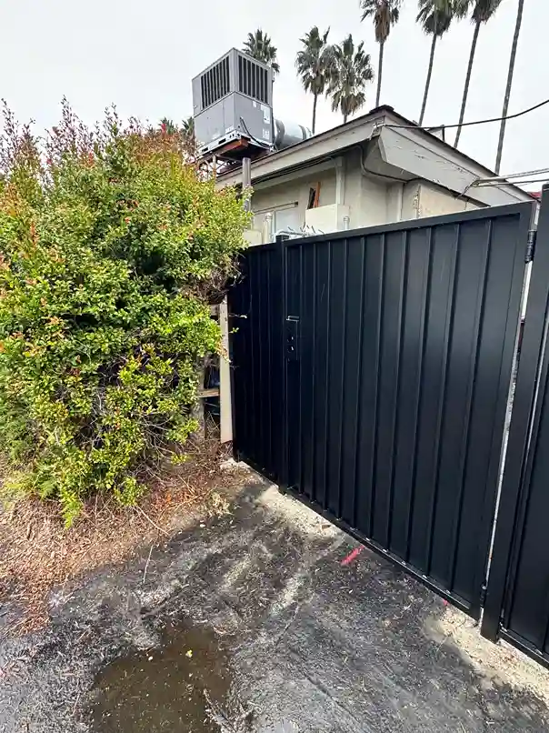All-metal solid black steel privacy gate with no wood, suited to ember-resistant fire zones